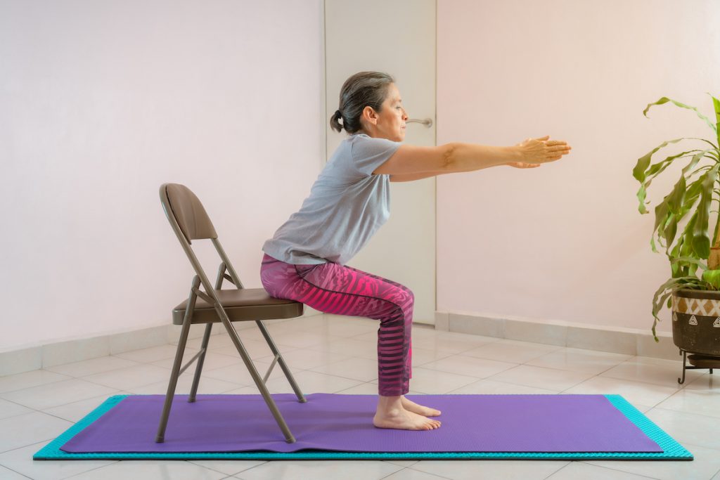 mature woman doing a sit to stand exercise for a story on the best thigh exercises