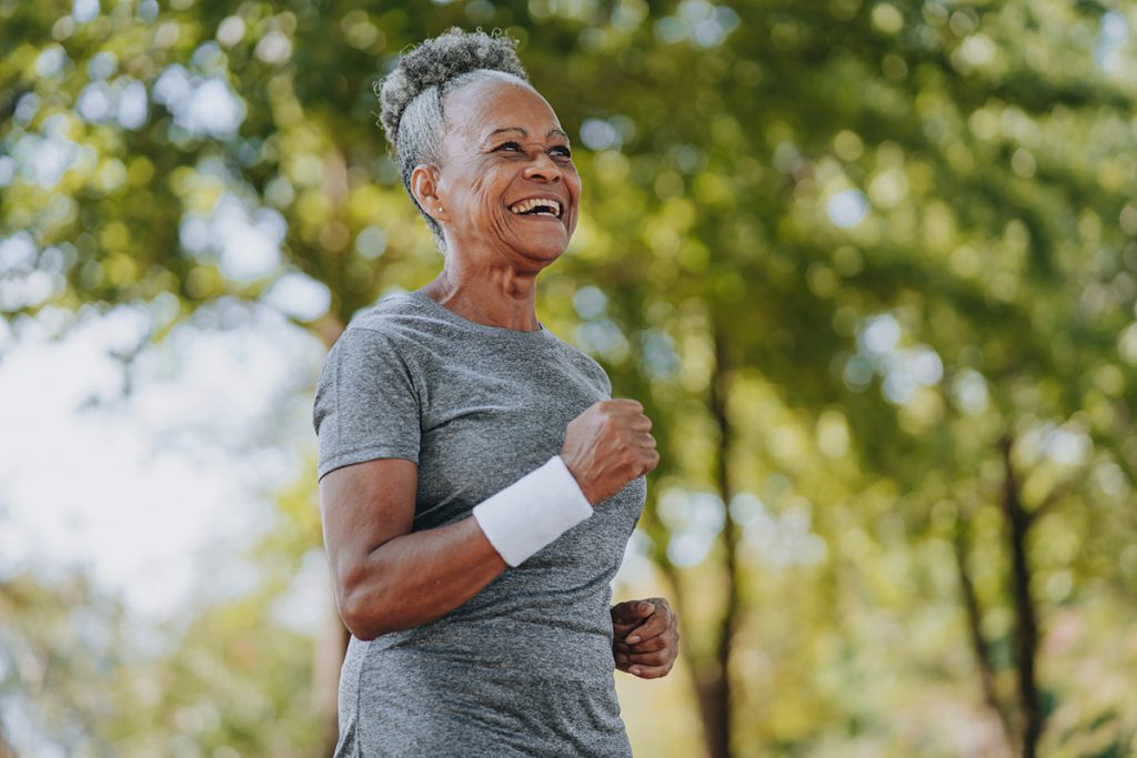 Older woman enjoying a run for a story on how much should I weigh