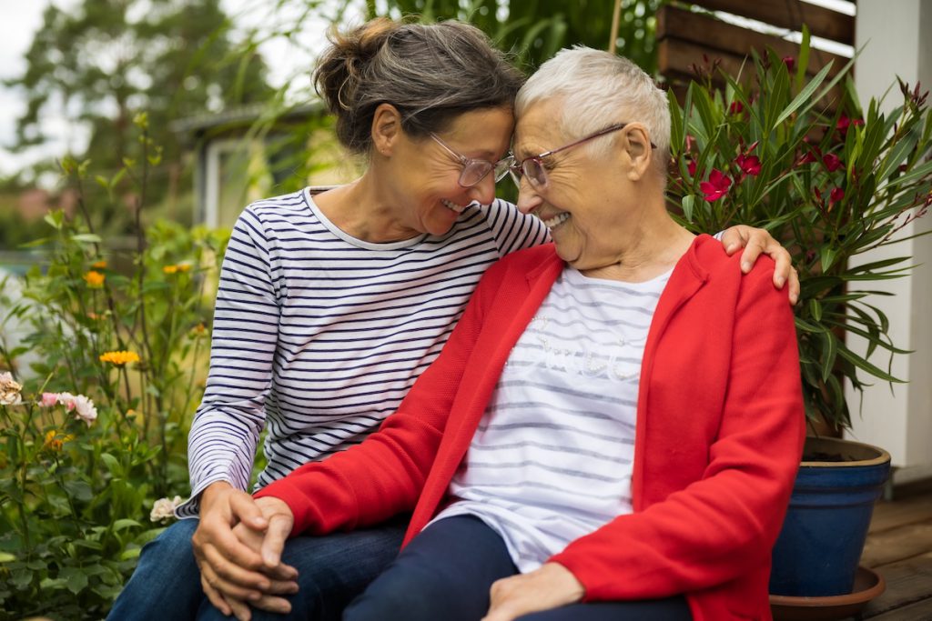 Mature woman taking care of older family member for a story on caregiver burnout