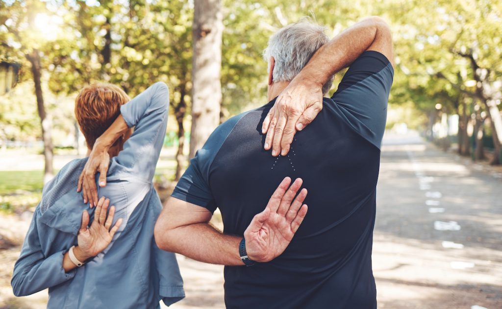 Senior couple stretching outdoors for a story on at-home fitness tests