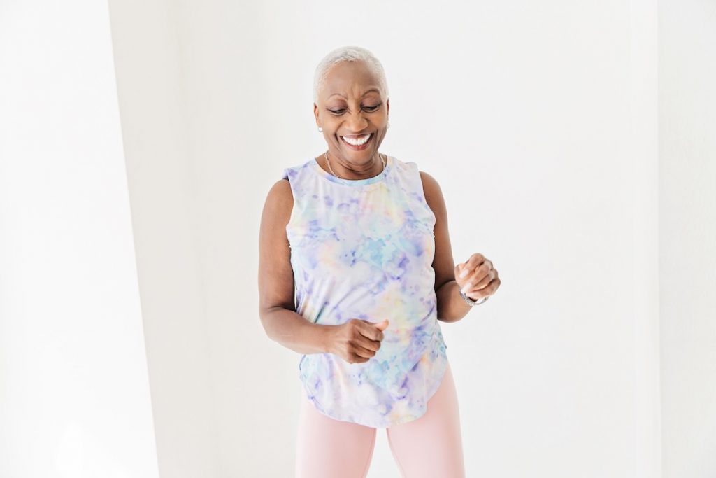 Senior Black woman staying active doing low-impact cardio exercise